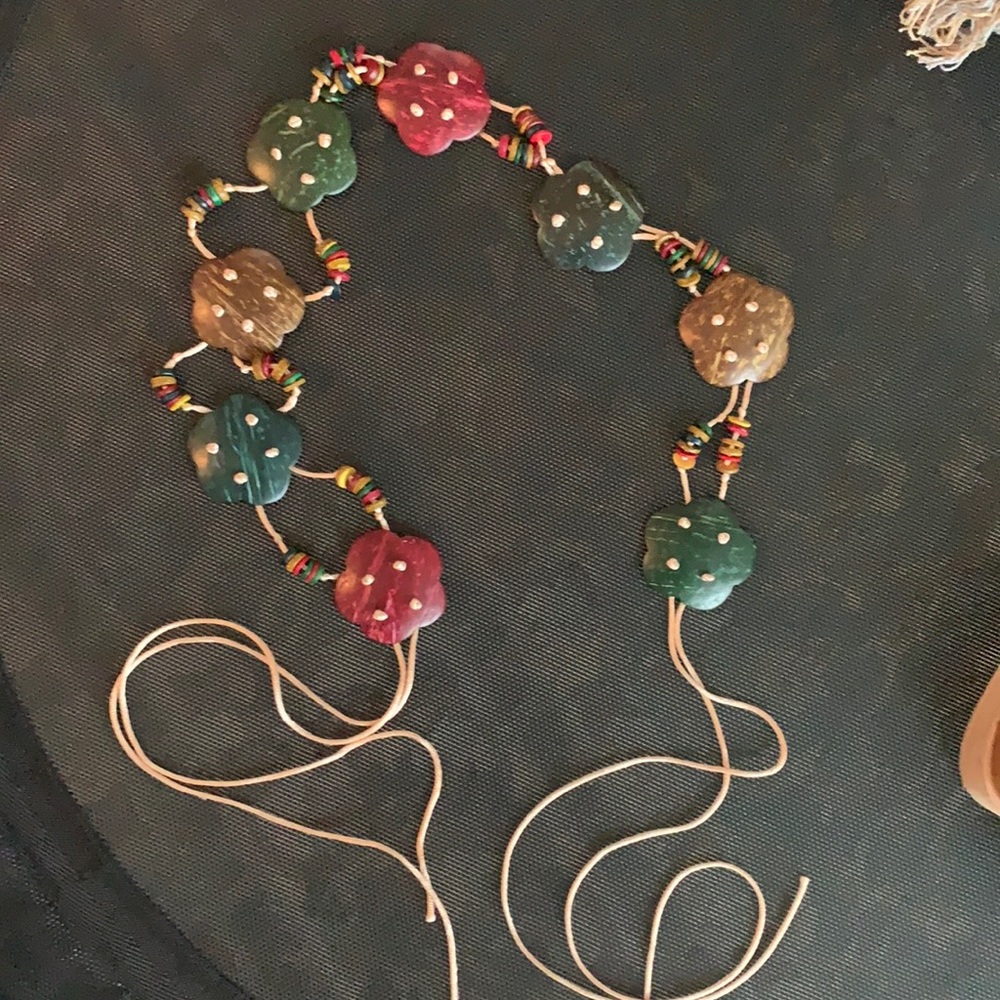 Red, blue, and brown wooden floral belt